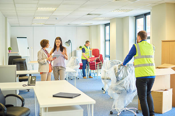 Couple packing home items into boxes before movers arrive
