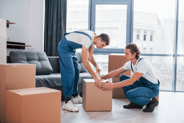 Family on moving day with packed boxes at a villa in Mirdif Dubai