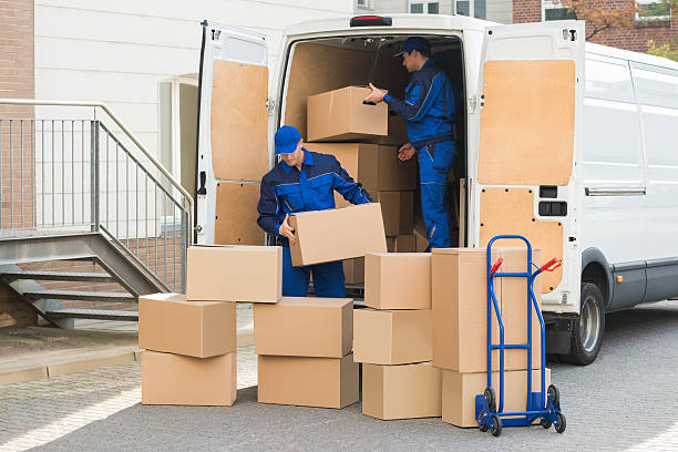 Movers loading furniture into a truck for a Fujairah move