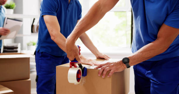 Professional packers carefully packing a living room before a UAE house move