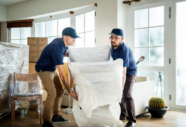 House shifting in the UAE by professional movers carrying a sofa