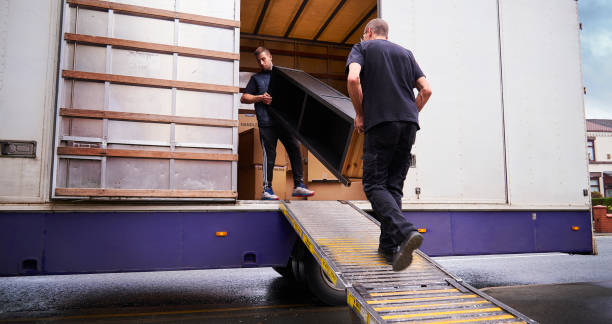 Mover with a hand trolley of boxes inside a residential tower on Al Reem Island Abu Dhabi