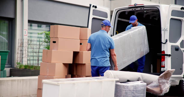 Moving crew with packed boxes ready for loading in Al Rashidiya Ajman